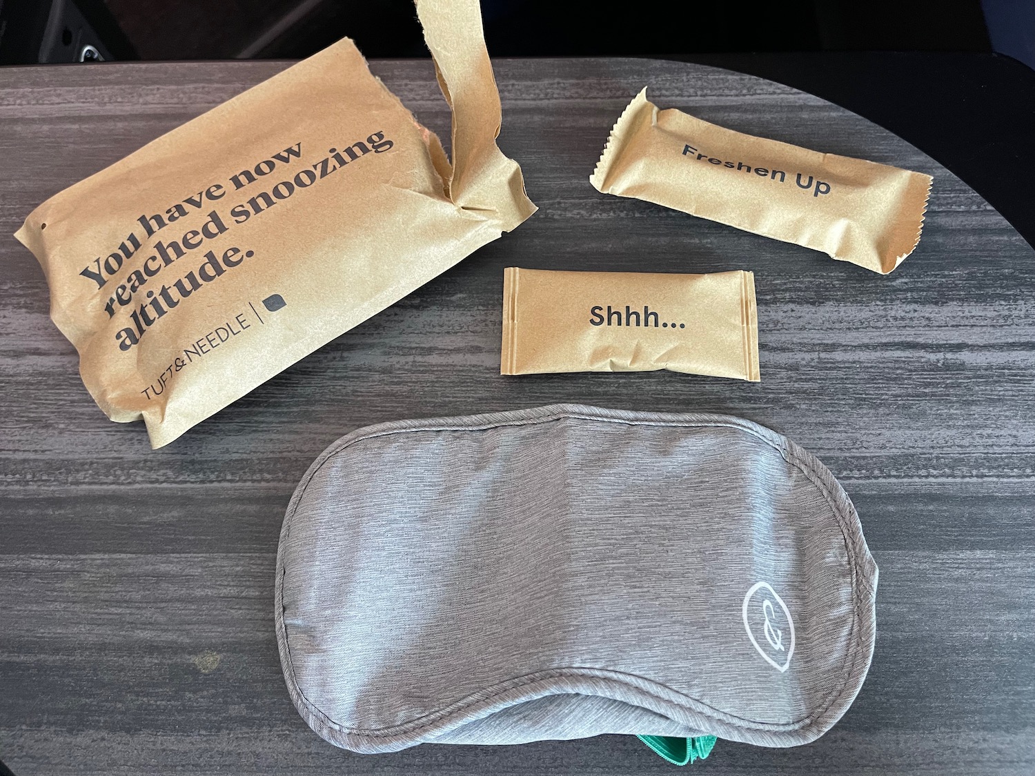 a group of brown packages next to a sleeping mask