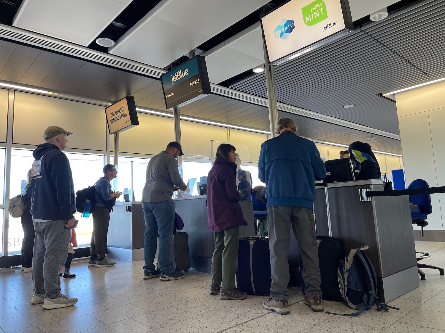 people standing in a line at a counter