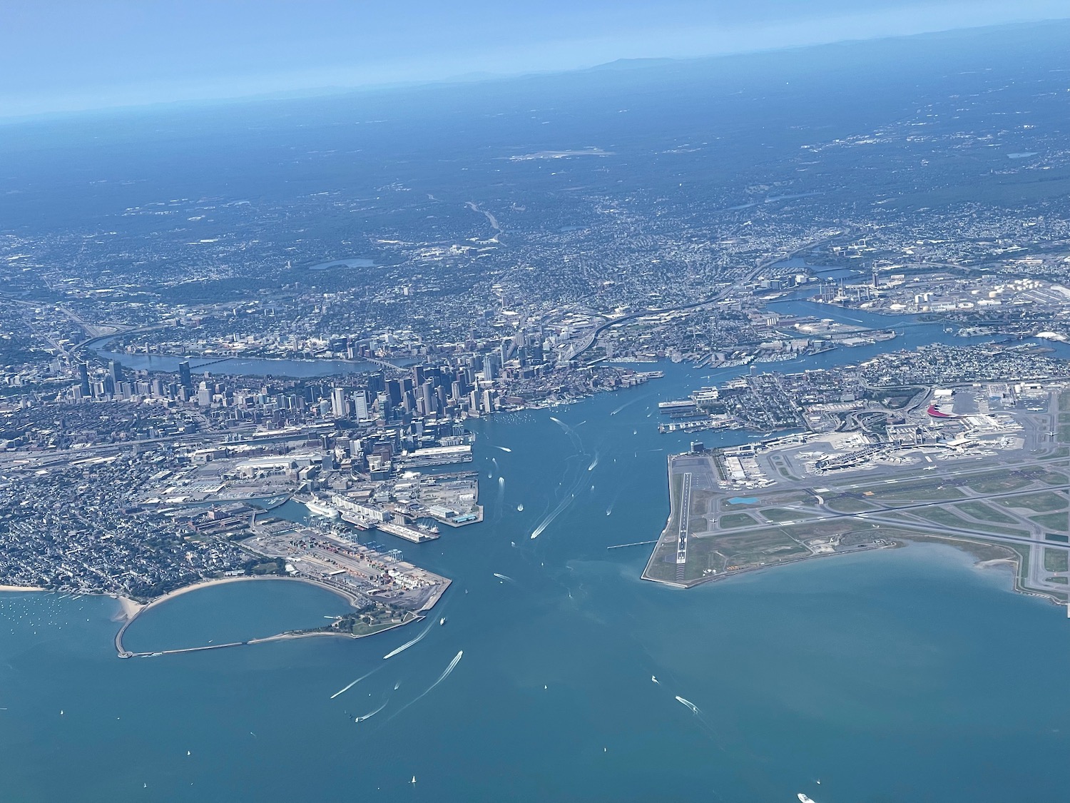 an aerial view of a city and water