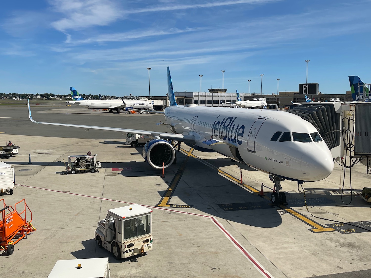 a jet blue airplane at an airport