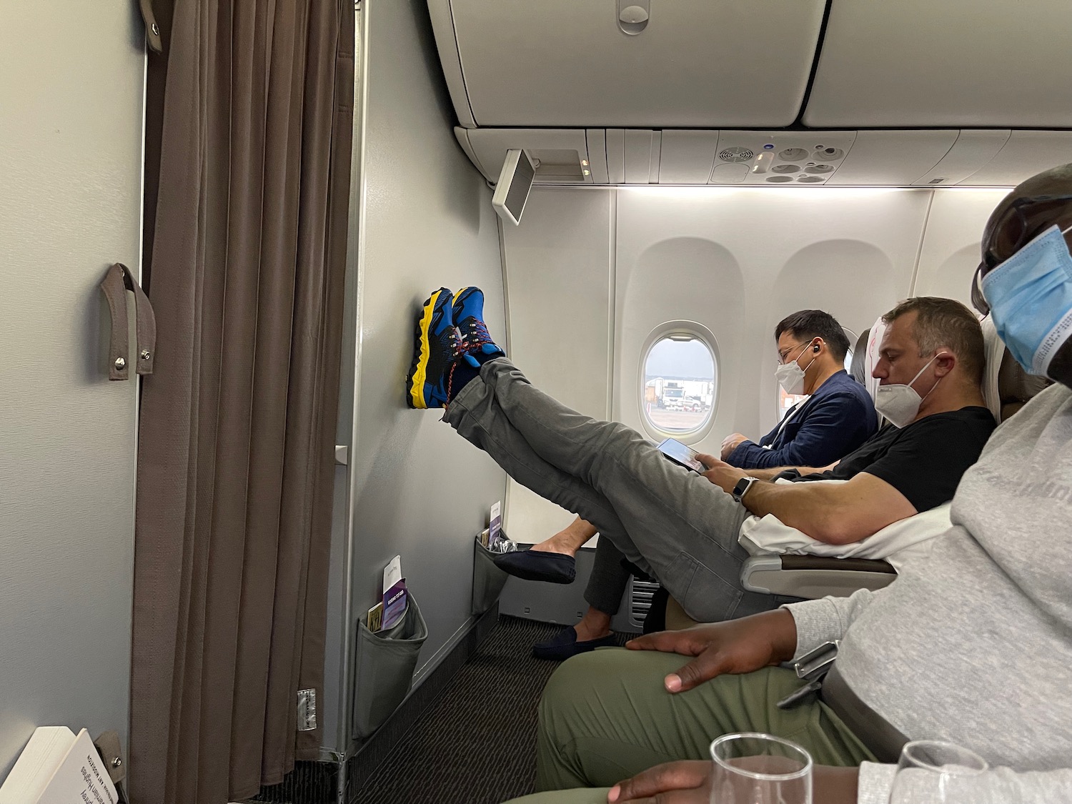 a group of people sitting on an airplane