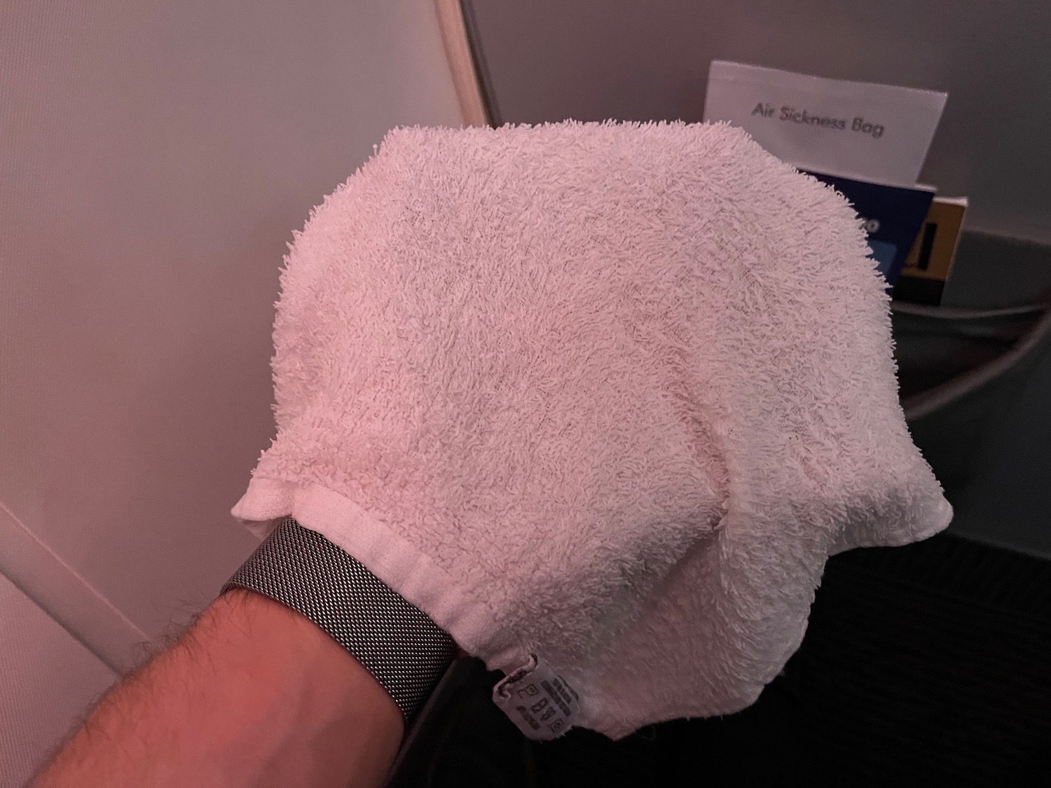 a hand holding a towel