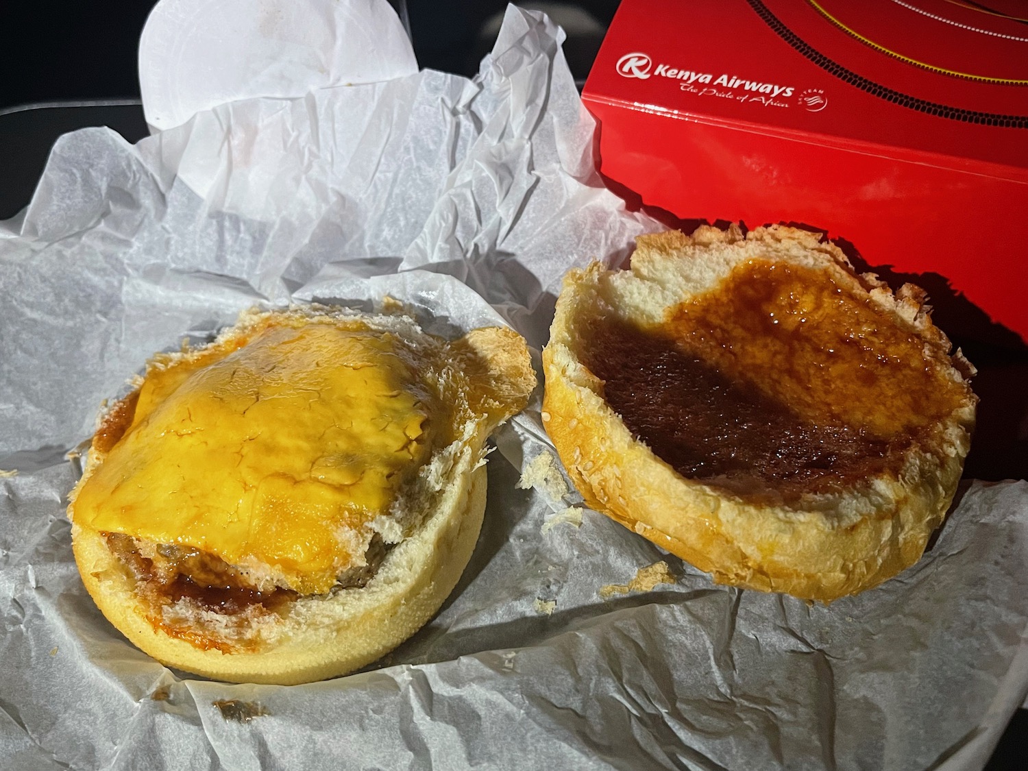a burger with a cheese and jam on it