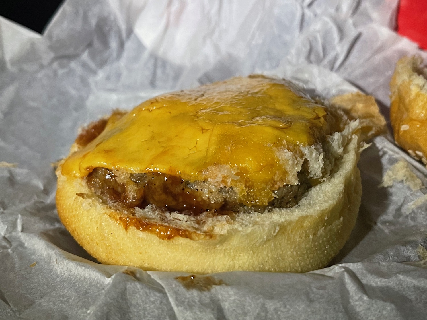 a burger with cheese on it