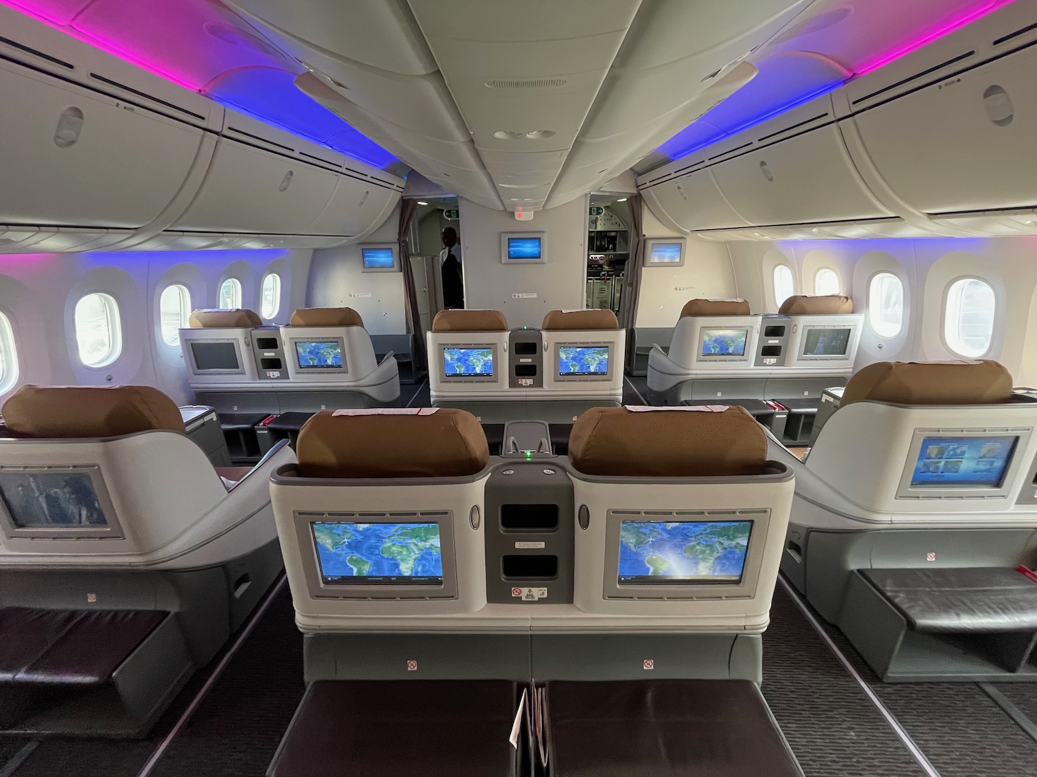 an airplane with many seats and monitors