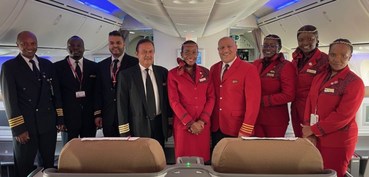 a group of people in uniform standing in a plane