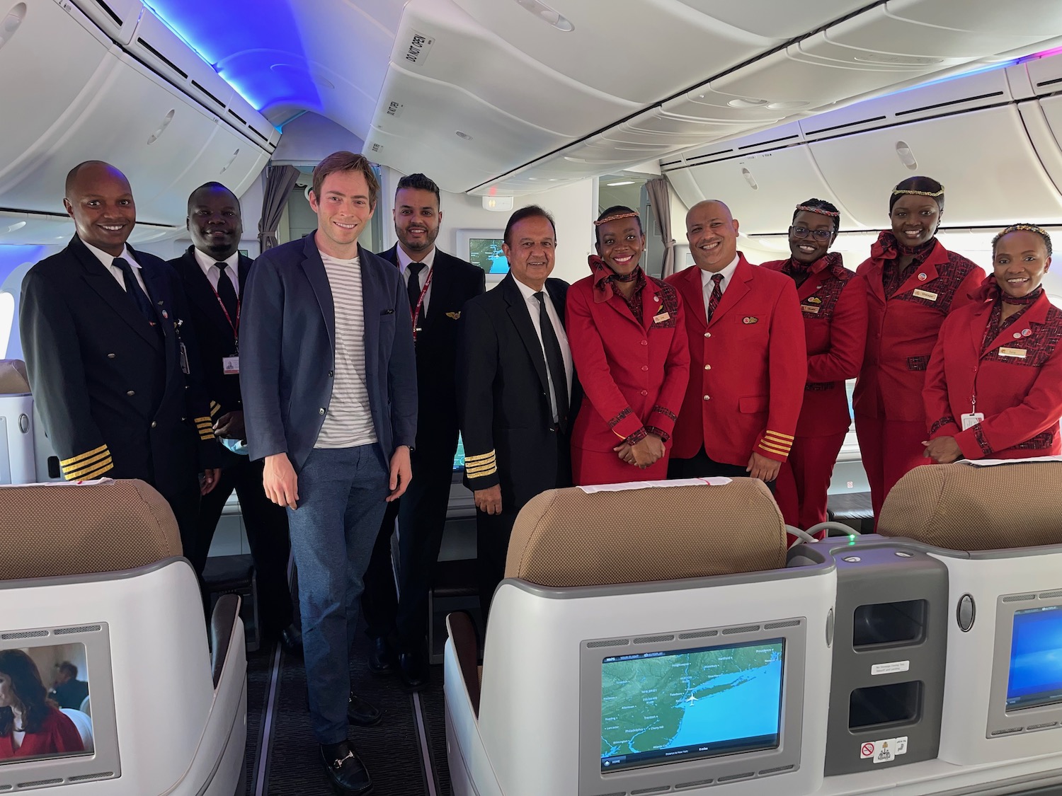 a group of people standing in an airplane