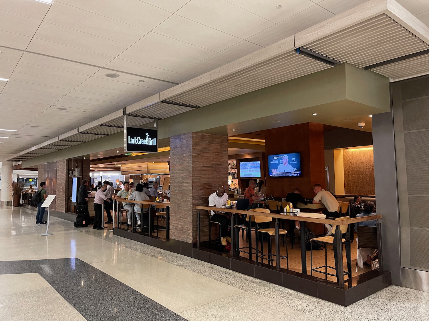 people sitting at tables in a building