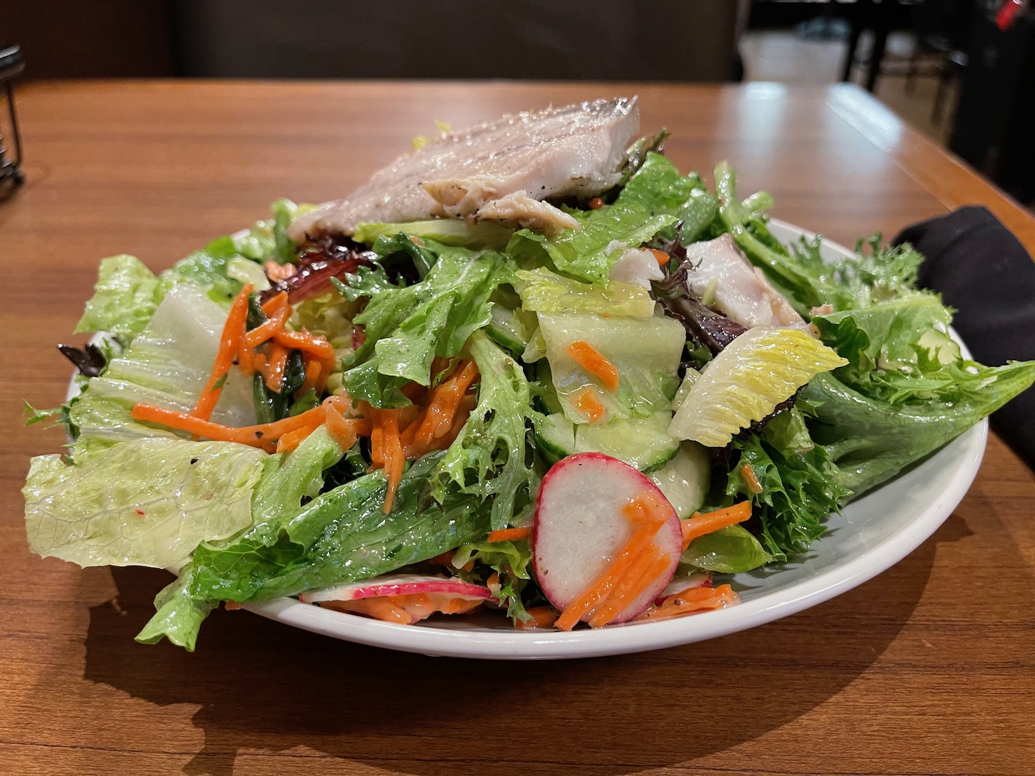 a plate of salad on a table