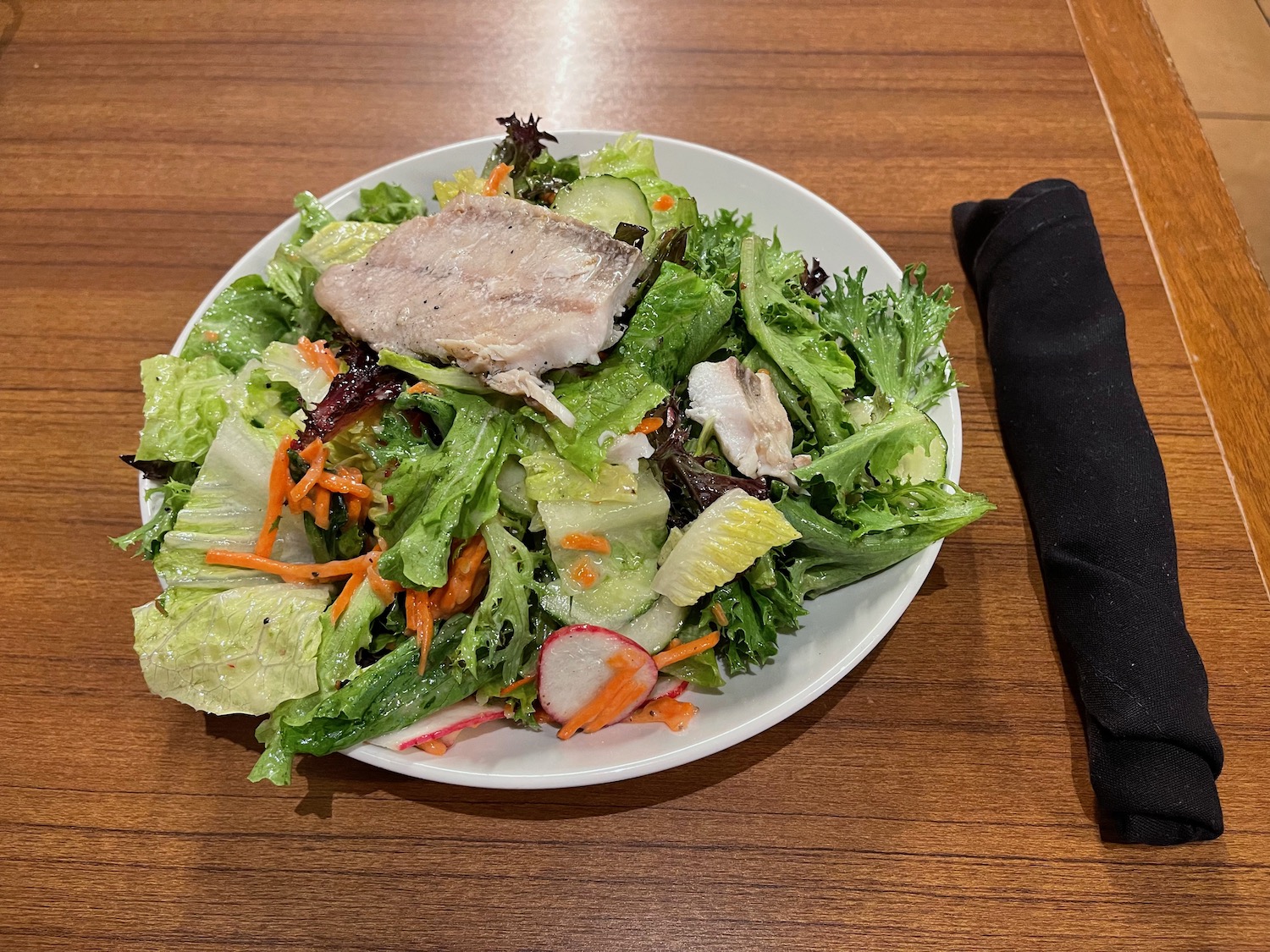 a plate of salad on a table