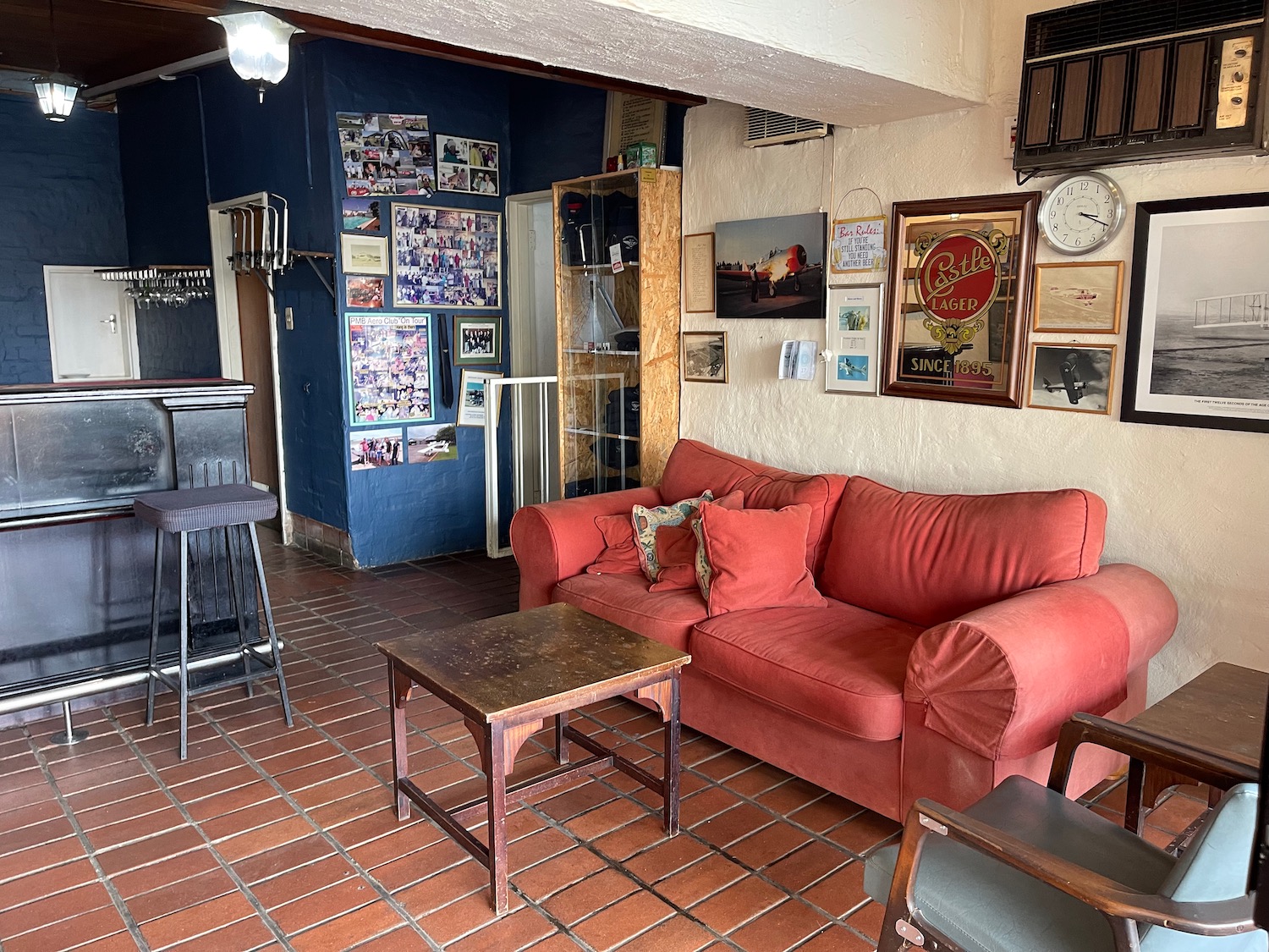 a living room with a red couch and a table