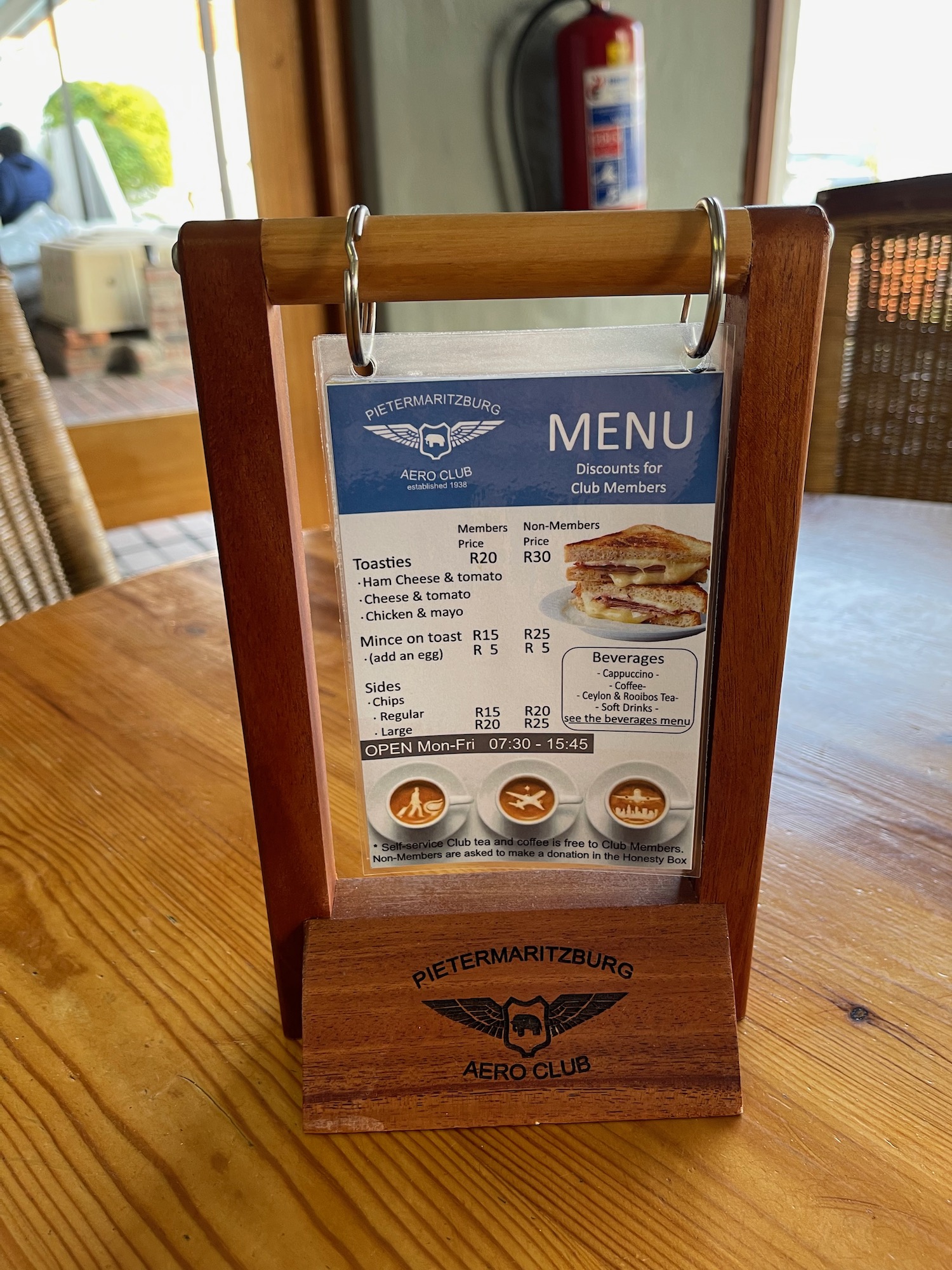 a menu on a wooden stand