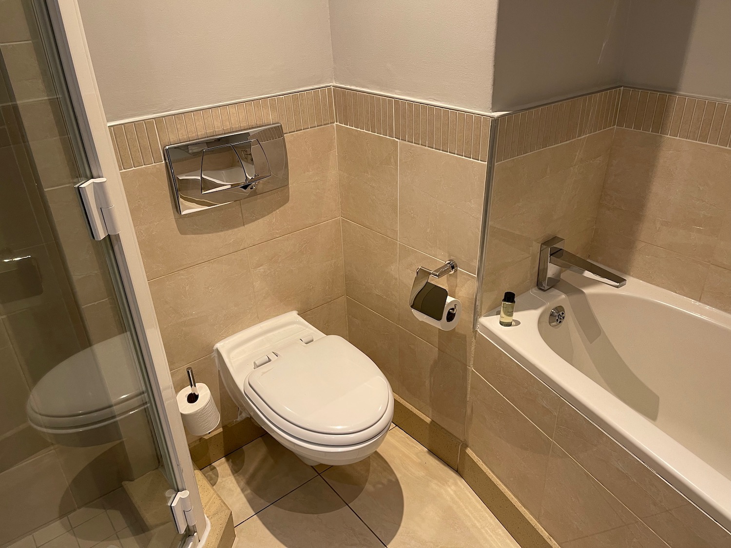 a bathroom with a toilet and bathtub