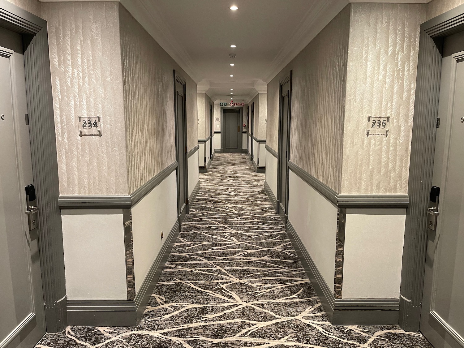 a hallway with a carpeted floor