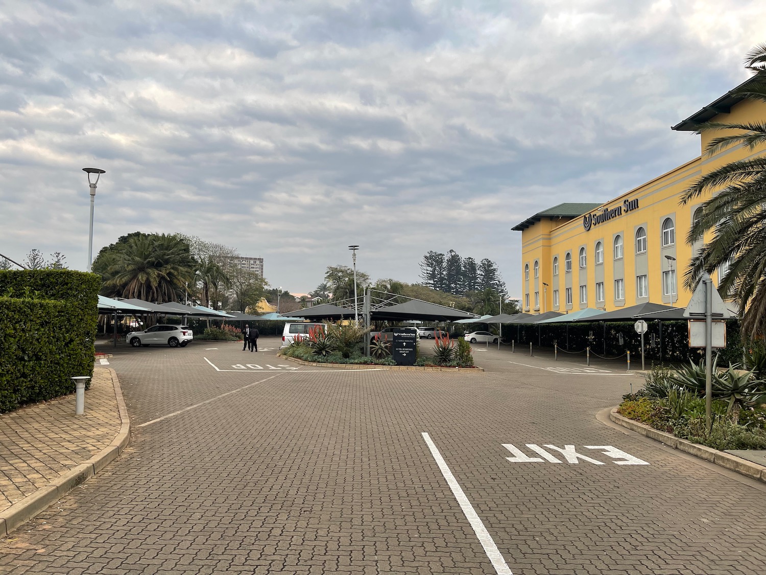 a parking lot with cars and buildings