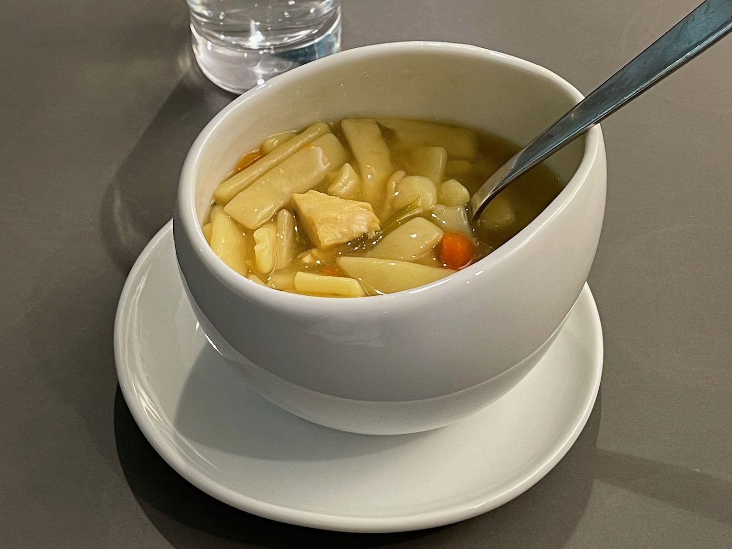 a bowl of soup with a spoon