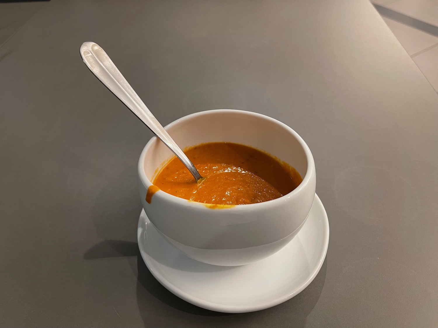 a bowl of soup with a spoon