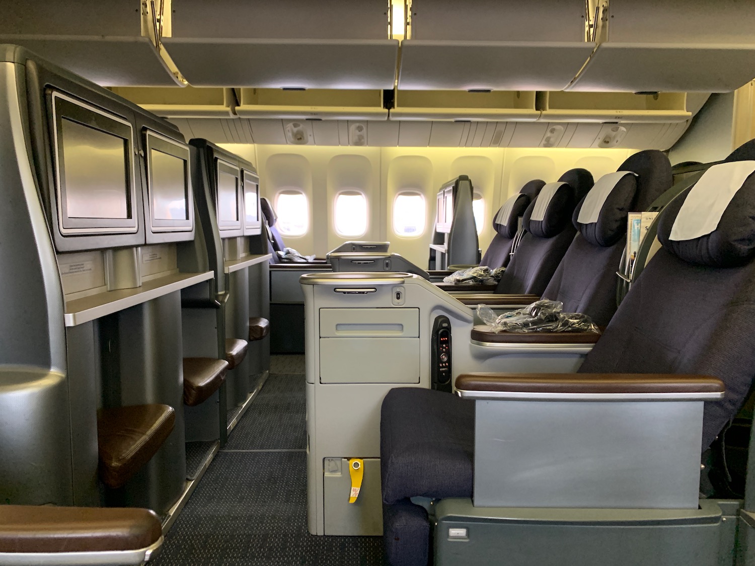 the inside of an airplane with seats and windows