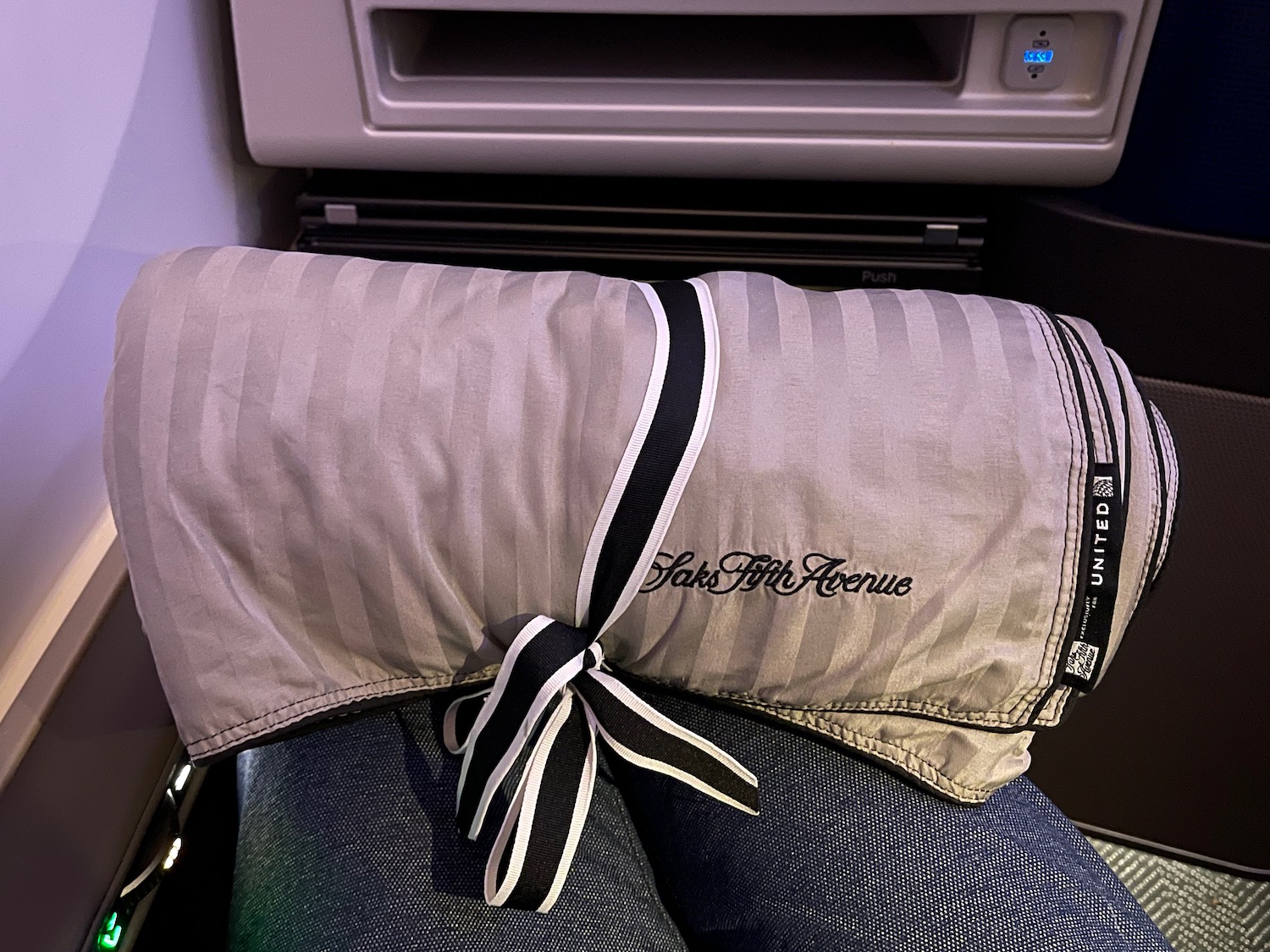 a pillow on a person's lap