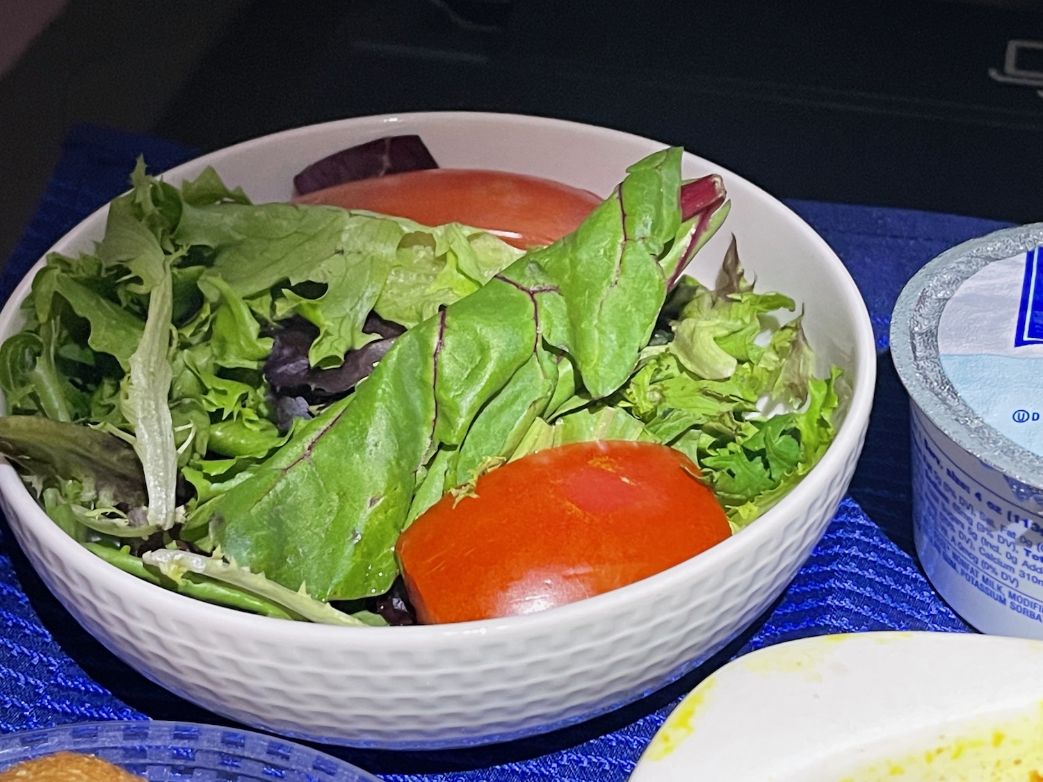 a bowl of salad on a table