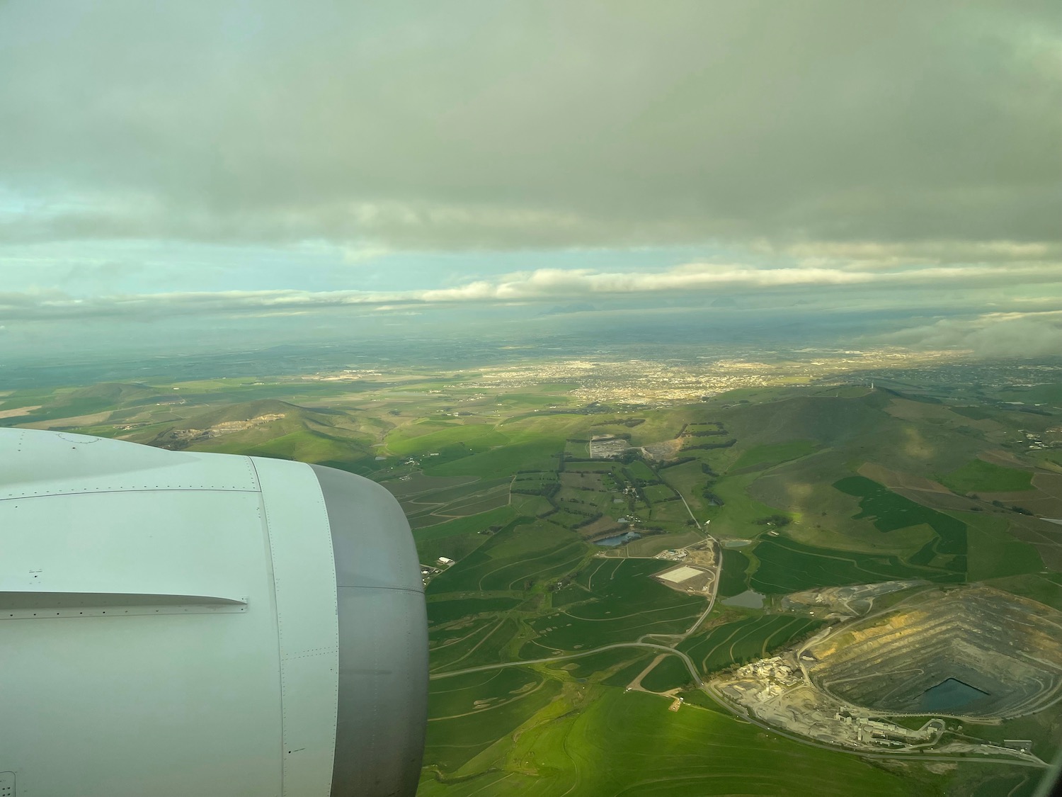 an airplane wing and a landscape