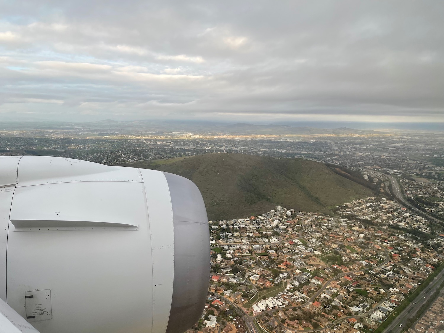 an airplane wing and a city