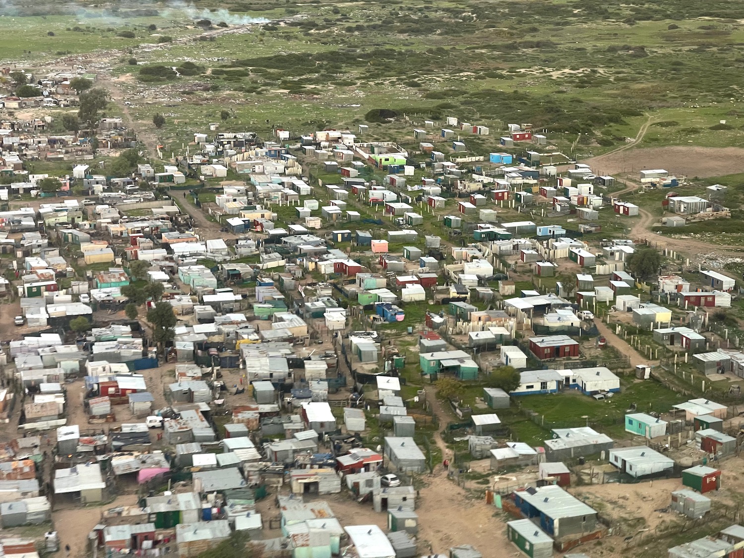 a group of houses in a field