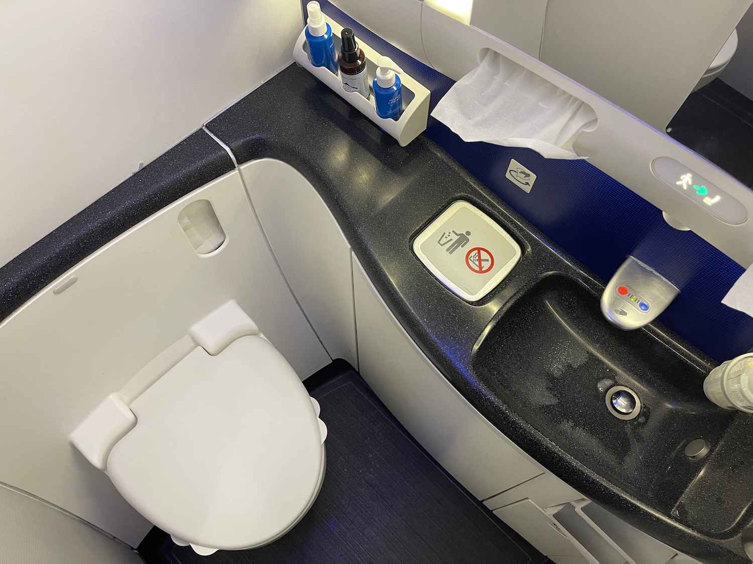 a toilet and sink in a bathroom