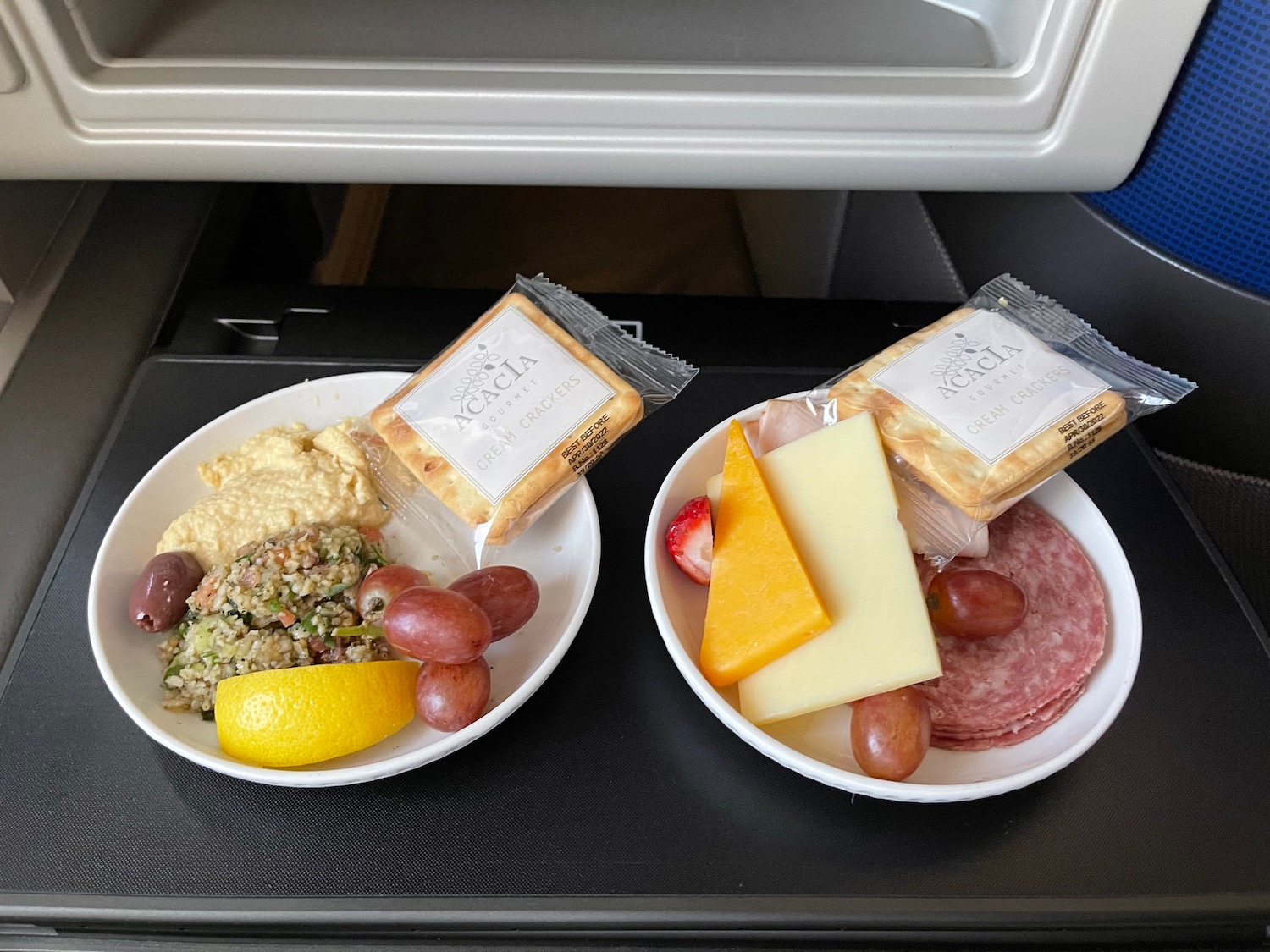 two plates of food on a tray