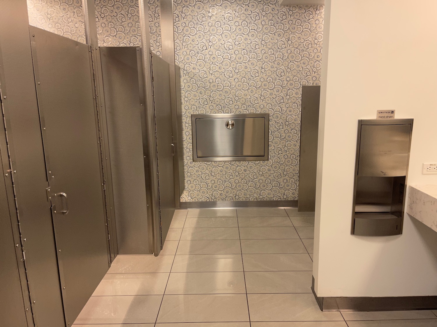 a bathroom with stainless steel doors