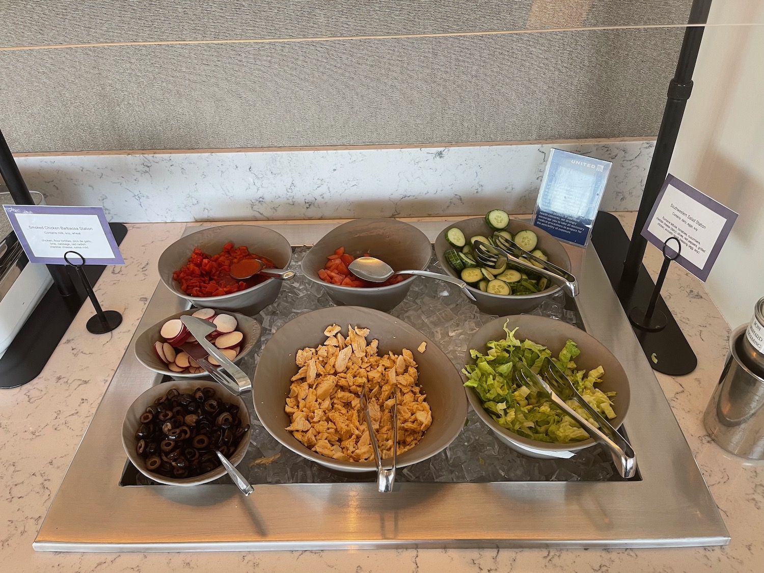 a group of bowls of food on a tray