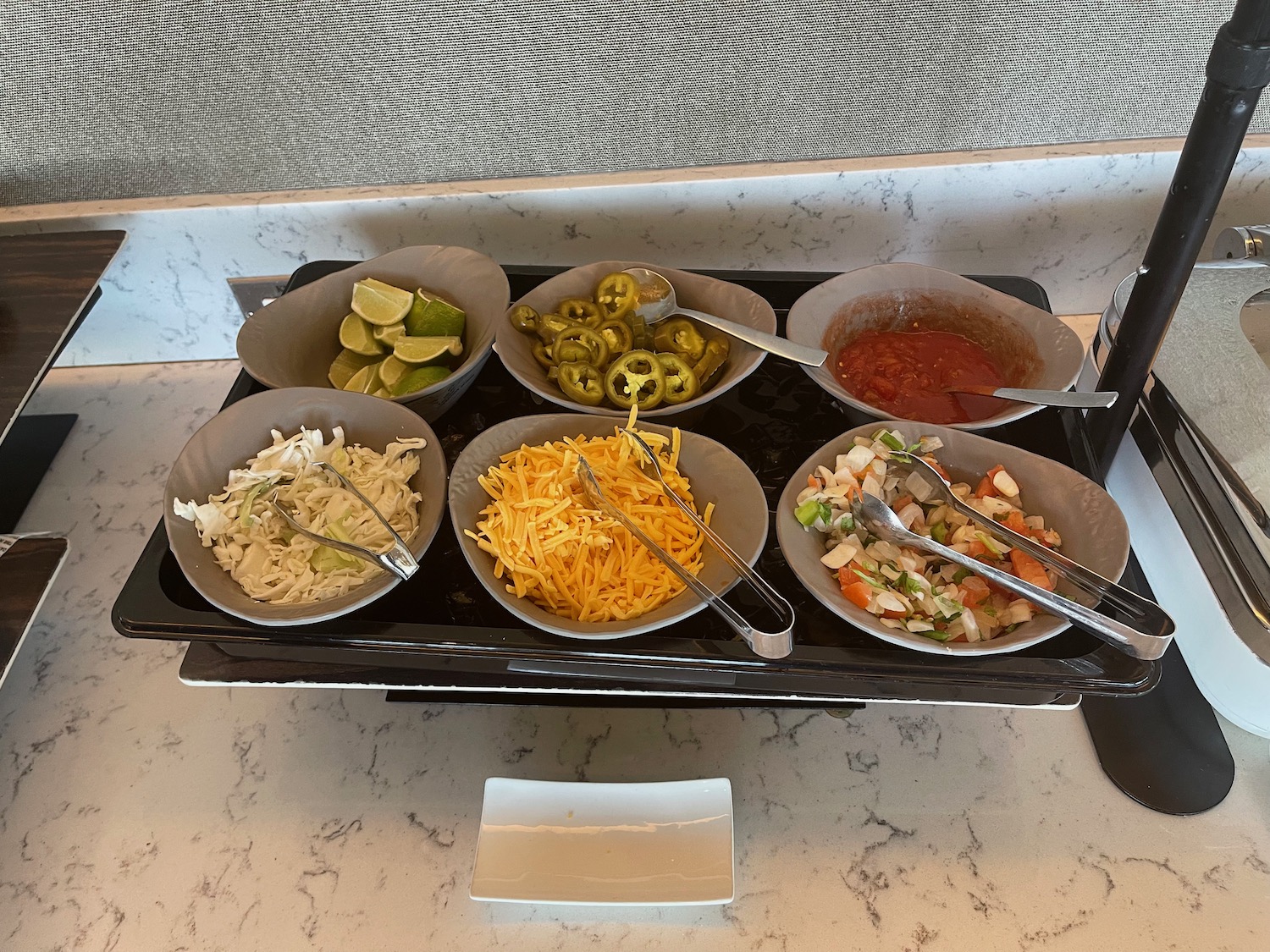 a tray of food with bowls of food