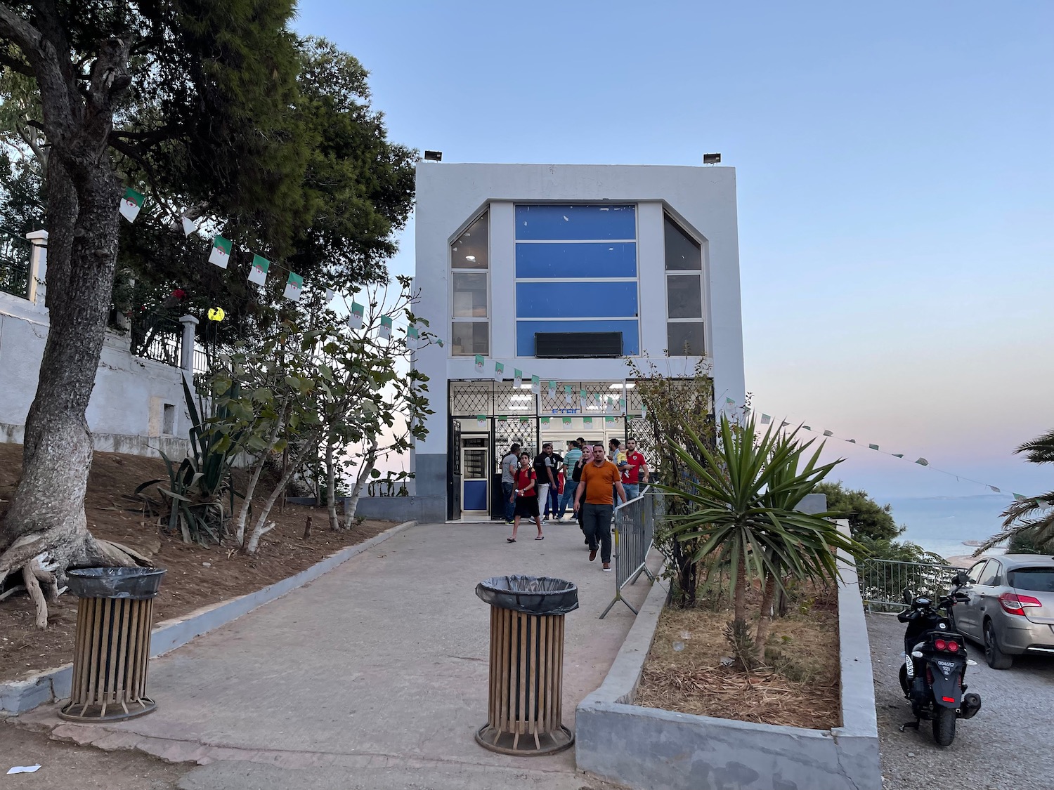 a group of people walking in front of a building