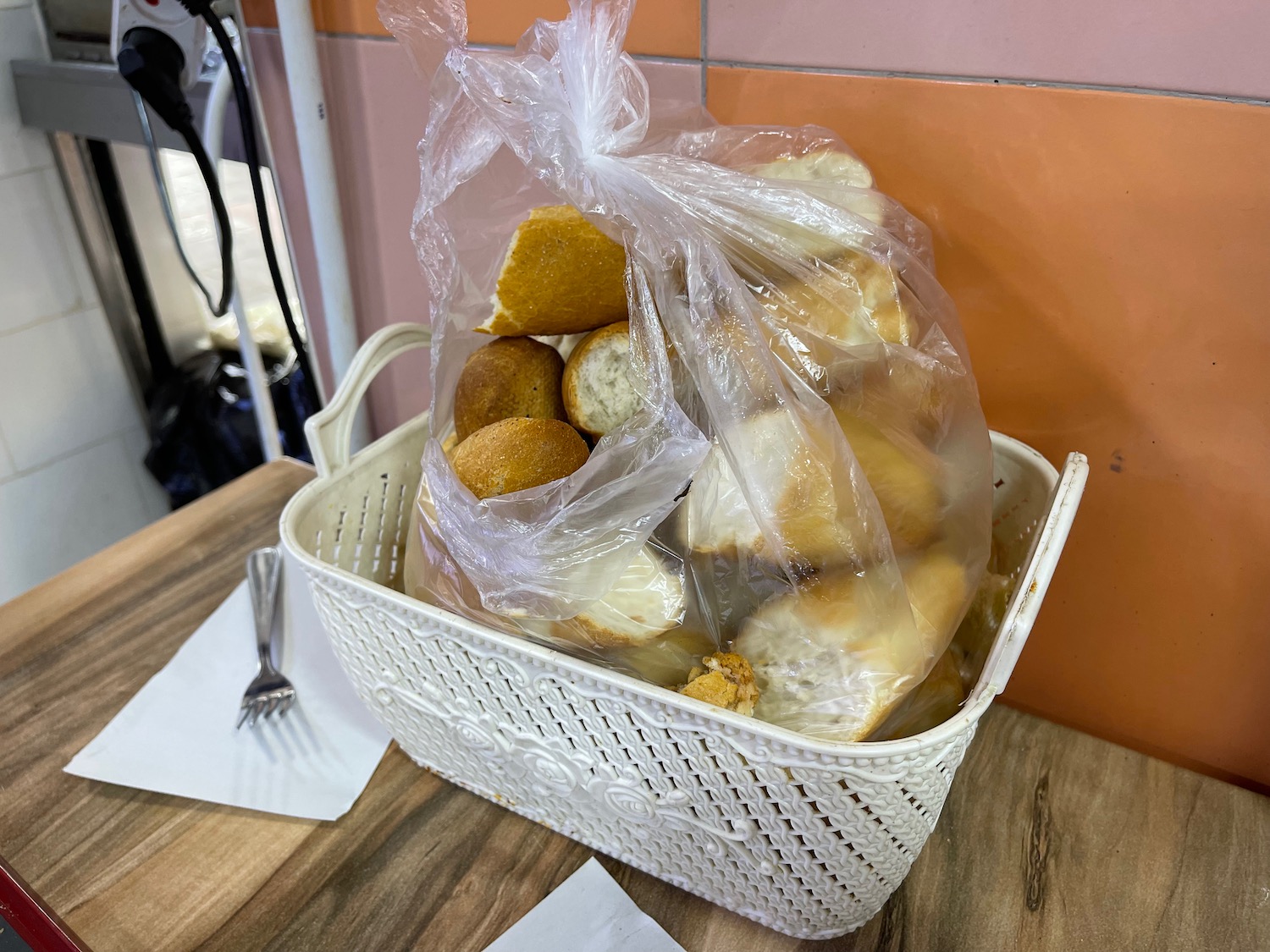 a basket of bread in a plastic bag