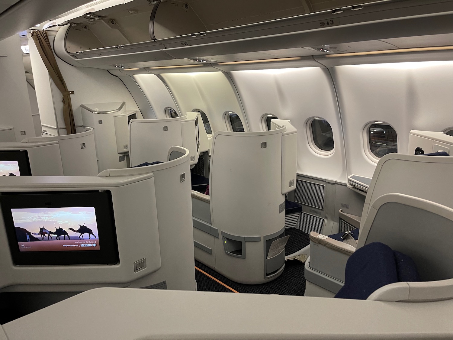 an airplane with seats and a television