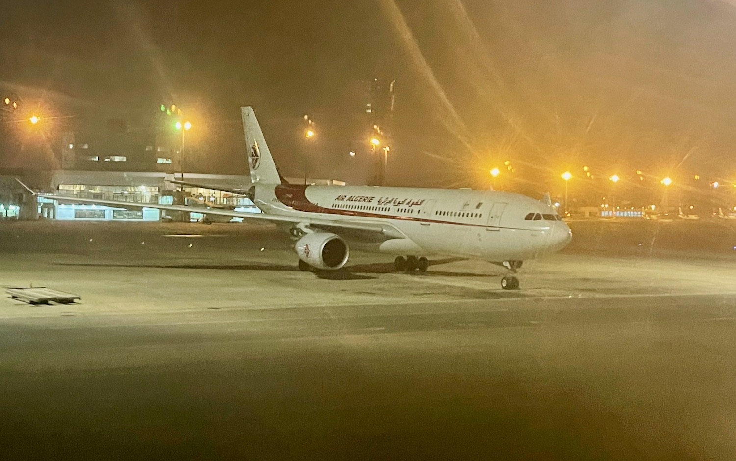 a plane on the runway at night