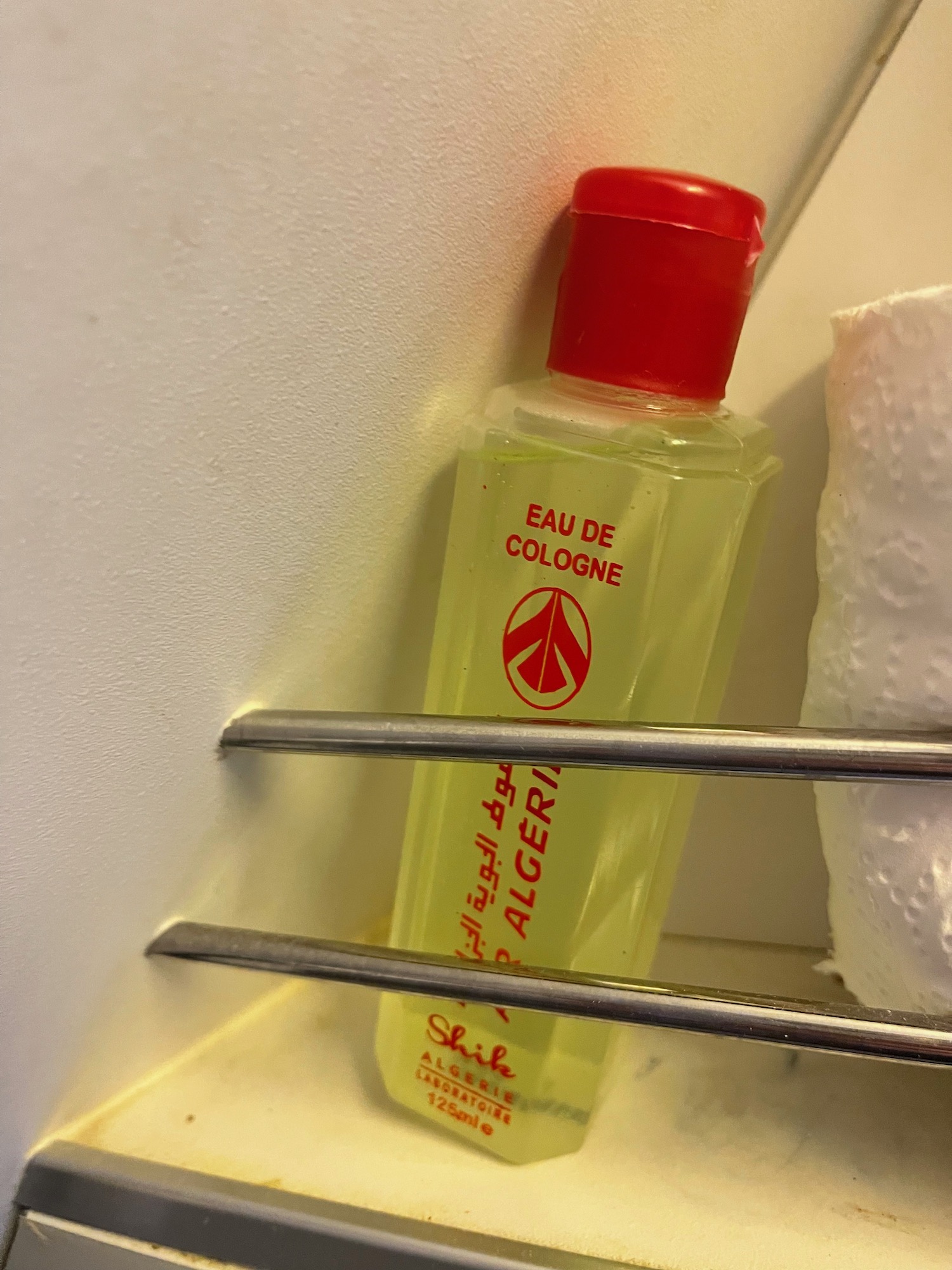 a bottle of cologne on a shelf