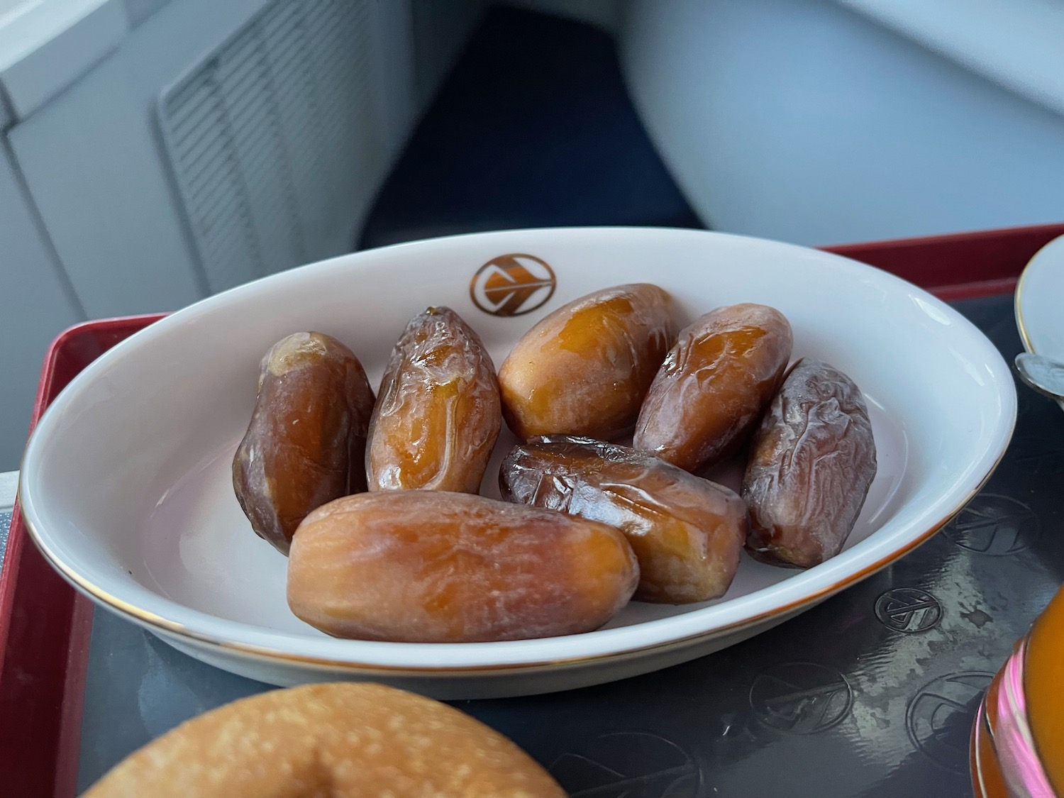 a bowl of dates on a tray