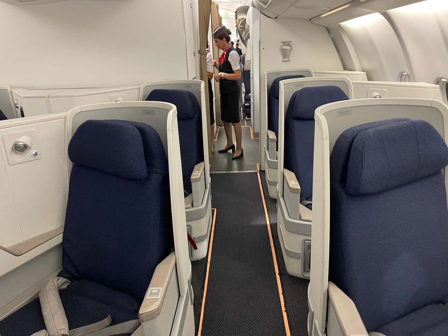 a person standing in a row of seats