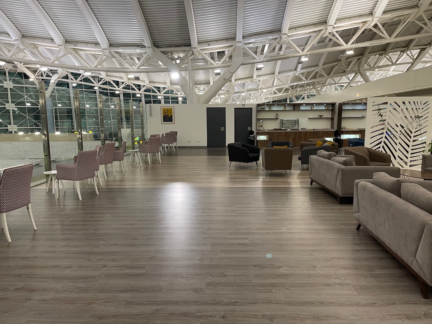 a room with chairs and a large ceiling