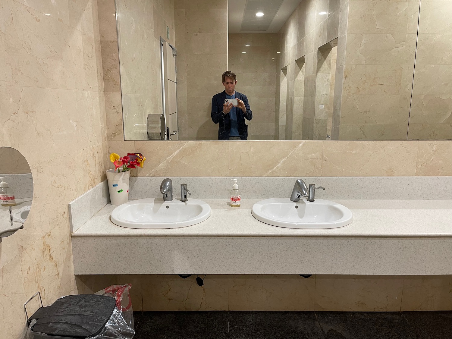 a man taking a selfie in a bathroom