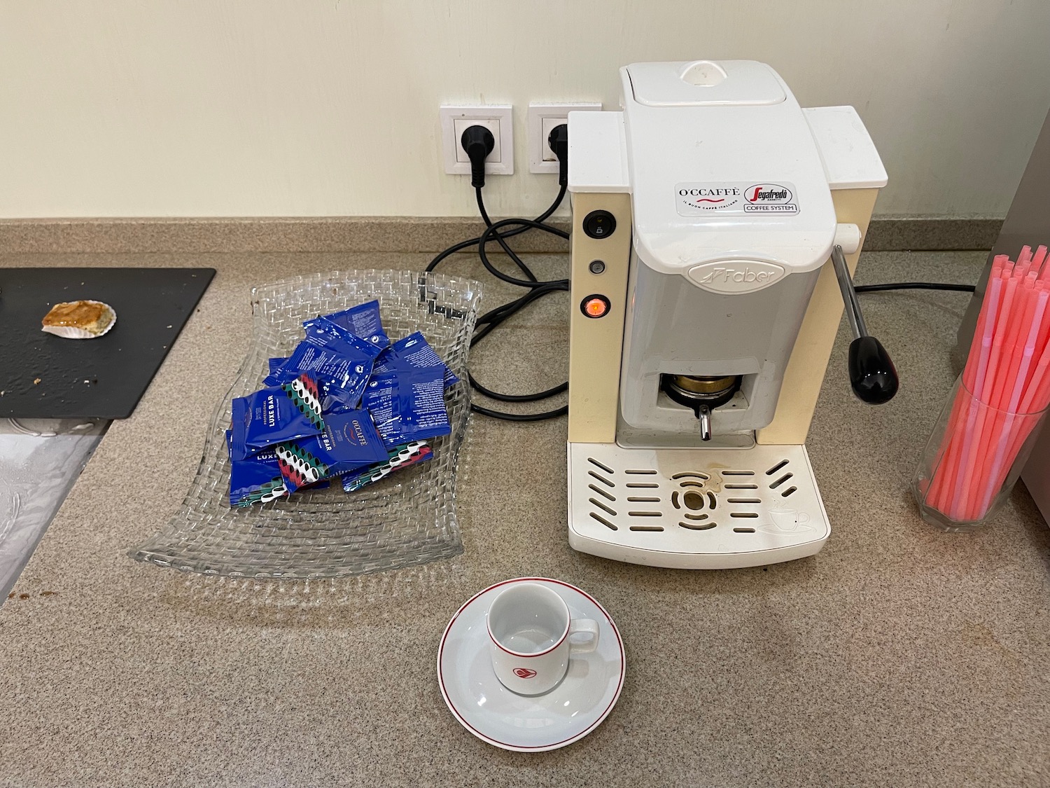 a coffee machine with a cup and saucer