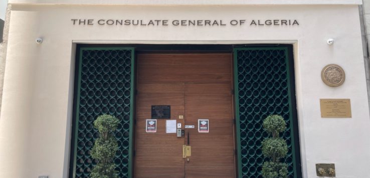 a building with a door and a sign