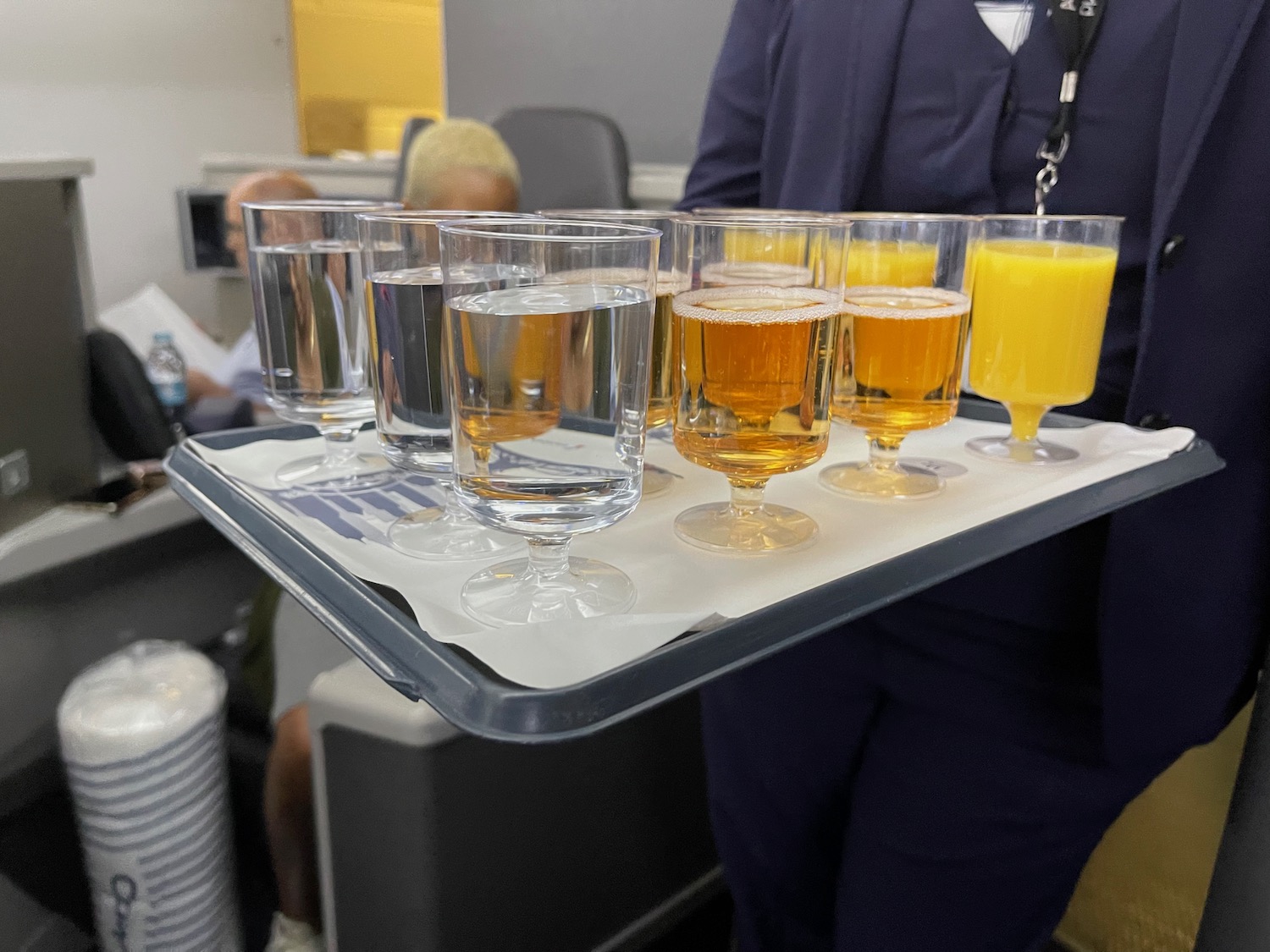 a tray of glasses with different drinks