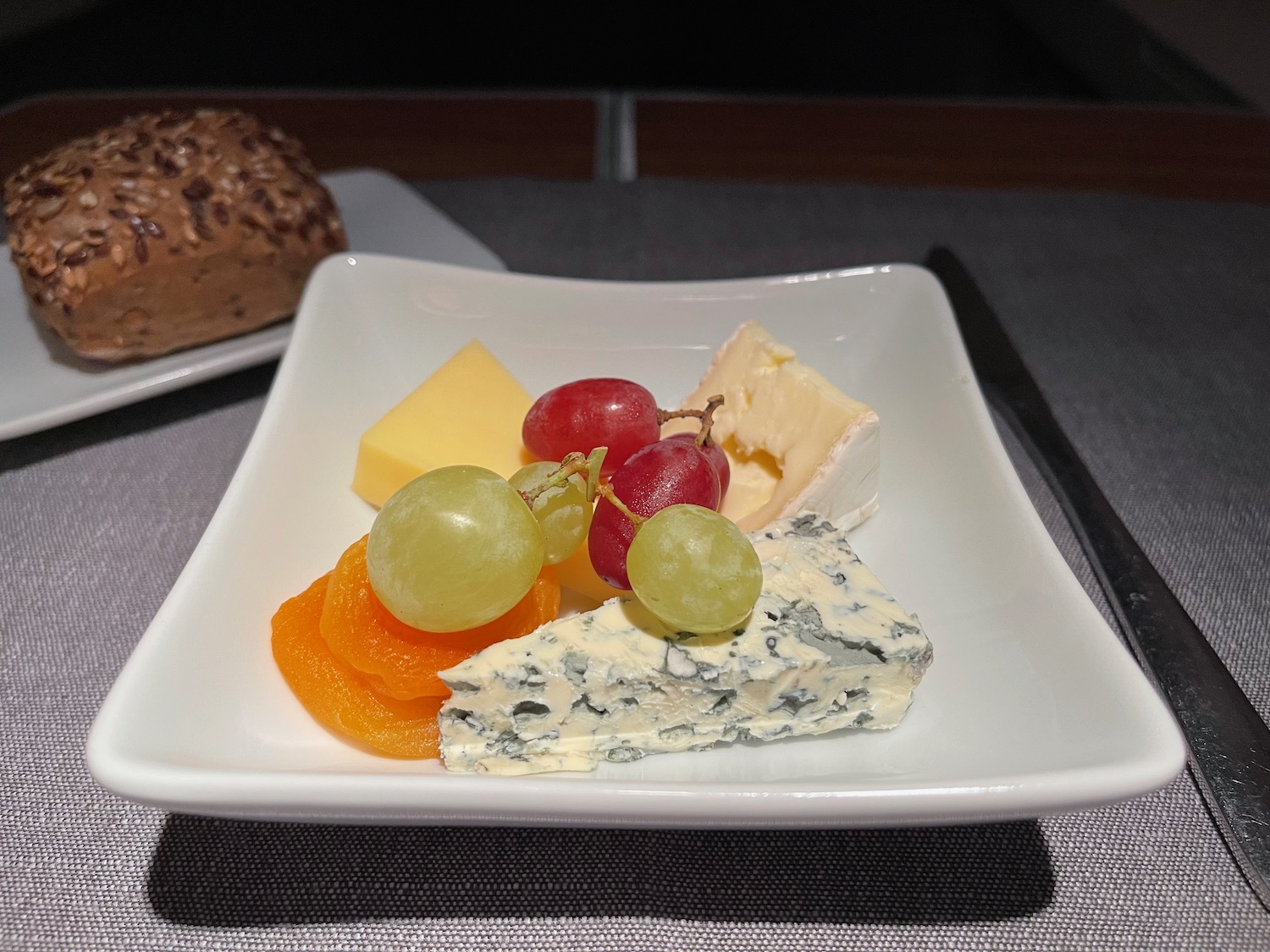 a plate of cheese and fruit