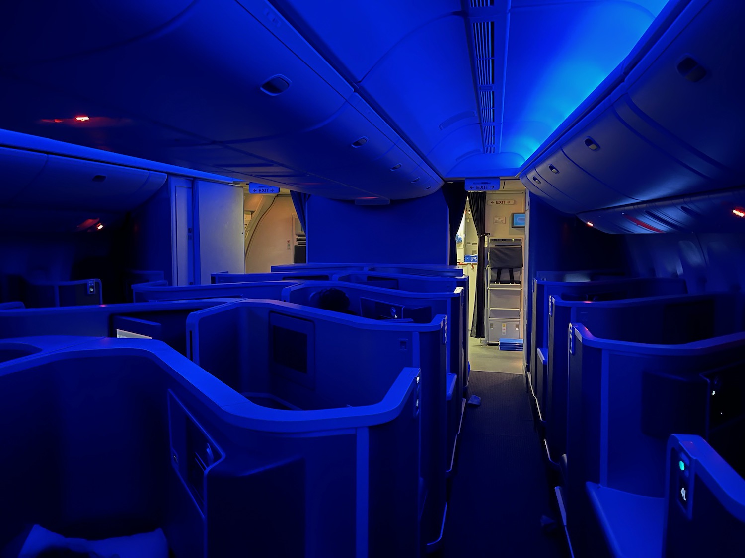 an inside of an airplane with blue lights