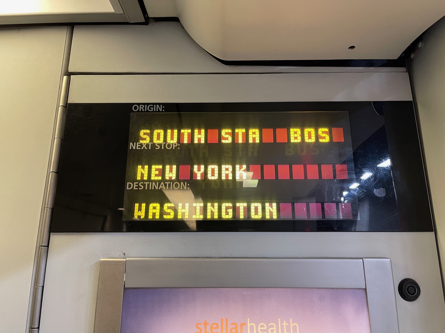 a digital display with yellow and red letters