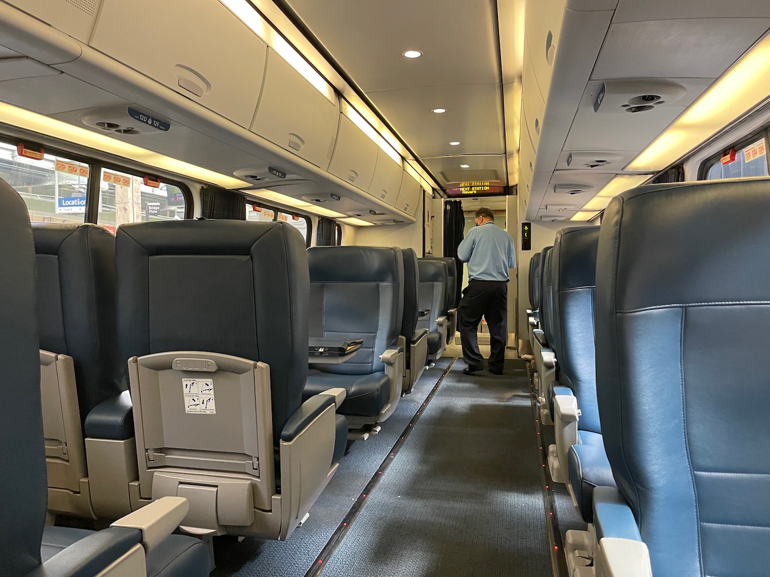 a man standing in a train