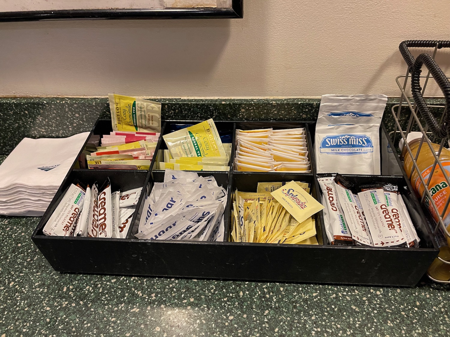 a black tray with several packets in it