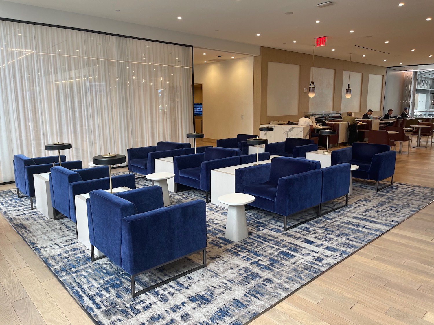 a room with blue chairs and tables